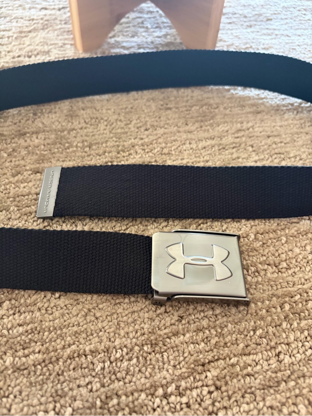 Under Armour Black Web Belt with Metal Logo Buckle approximately 36 1/4 inches.